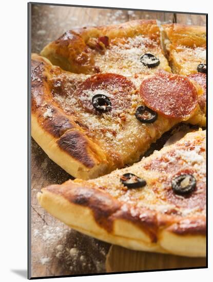 Pizza with Salami, Cheese and Olives, Pieces Cut-null-Mounted Photographic Print