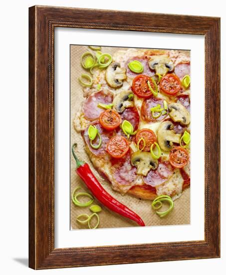 Pizza with Salami, Mushrooms, Tomatoes, Leek, Mozzarella and Chillis-Ira Leoni-Framed Photographic Print