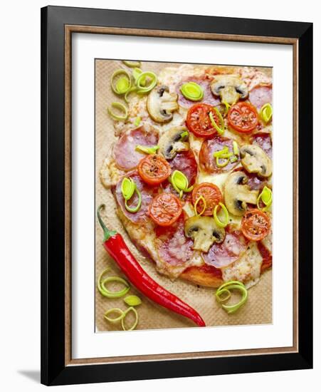 Pizza with Salami, Mushrooms, Tomatoes, Leek, Mozzarella and Chillis-Ira Leoni-Framed Photographic Print