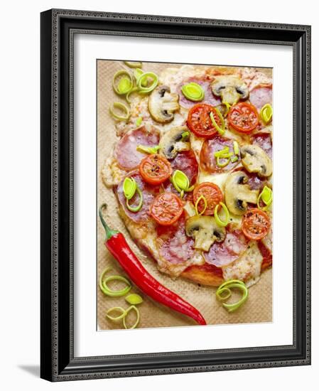 Pizza with Salami, Mushrooms, Tomatoes, Leek, Mozzarella and Chillis-Ira Leoni-Framed Photographic Print