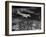 Plane Flying over a City from a Story Concerning United Airlines-Carl Mydans-Framed Photographic Print