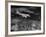 Plane Flying over a City from a Story Concerning United Airlines-Carl Mydans-Framed Photographic Print