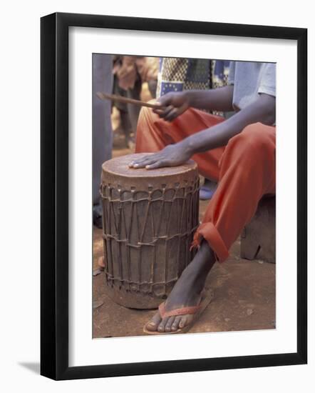 Playing a Congolese Drum in a Congolese Refugee Camp, Tanzania-Kristin Mosher-Framed Photographic Print