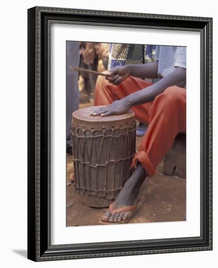 Playing a Congolese Drum in a Congolese Refugee Camp, Tanzania-Kristin Mosher-Framed Photographic Print