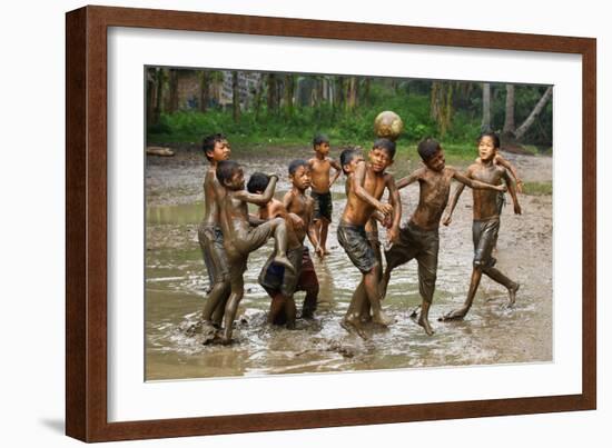 Playing Football-Angela Muliani Hartojo-Framed Photographic Print