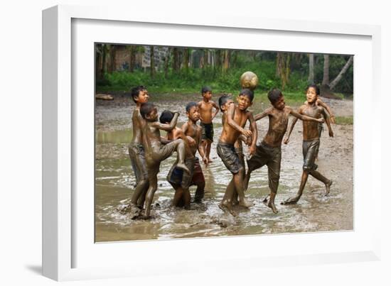 Playing Football-Angela Muliani Hartojo-Framed Photographic Print