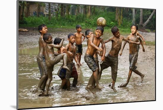 Playing Football-Angela Muliani Hartojo-Mounted Photographic Print