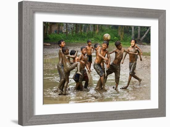 Playing Football-Angela Muliani Hartojo-Framed Premium Photographic Print