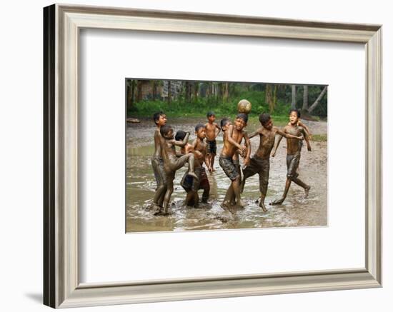 Playing Football-Angela Muliani Hartojo-Framed Photographic Print