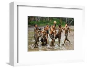 Playing Football-Angela Muliani Hartojo-Framed Photographic Print