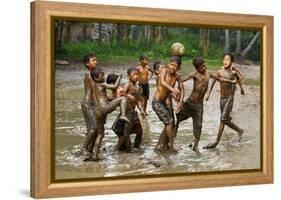 Playing Football-Angela Muliani Hartojo-Framed Premier Image Canvas