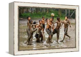 Playing Football-Angela Muliani Hartojo-Framed Premier Image Canvas