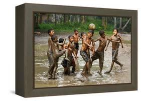 Playing Football-Angela Muliani Hartojo-Framed Premier Image Canvas