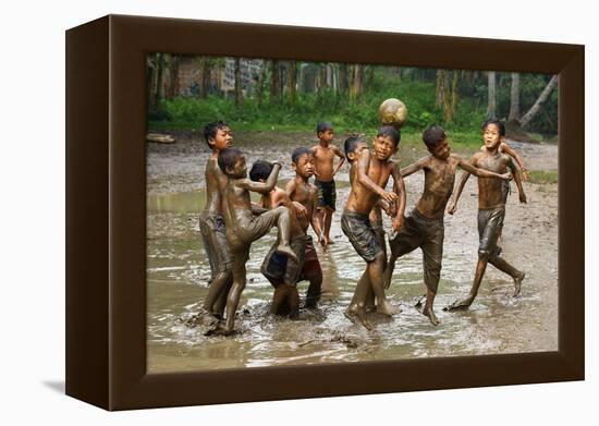 Playing Football-Angela Muliani Hartojo-Framed Premier Image Canvas