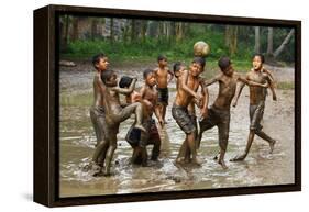 Playing Football-Angela Muliani Hartojo-Framed Premier Image Canvas