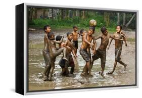 Playing Football-Angela Muliani Hartojo-Framed Premier Image Canvas