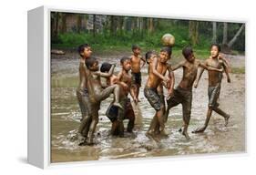 Playing Football-Angela Muliani Hartojo-Framed Premier Image Canvas