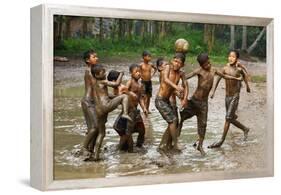 Playing Football-Angela Muliani Hartojo-Framed Premier Image Canvas