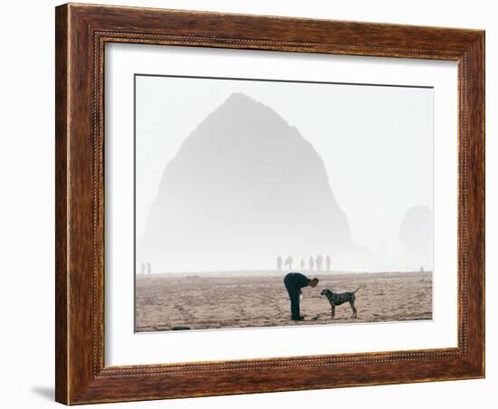 Playing Frisbee on Misty Morning, Cannon Beach, Oregon, USA-Janis Miglavs-Framed Photographic Print