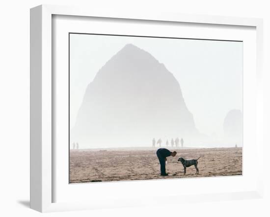 Playing Frisbee on Misty Morning, Cannon Beach, Oregon, USA-Janis Miglavs-Framed Photographic Print