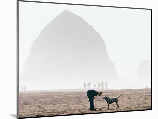 Playing Frisbee on Misty Morning, Cannon Beach, Oregon, USA-Janis Miglavs-Mounted Photographic Print