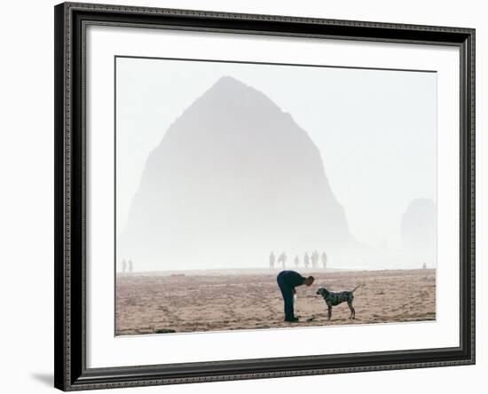 Playing Frisbee on Misty Morning, Cannon Beach, Oregon, USA-Janis Miglavs-Framed Photographic Print