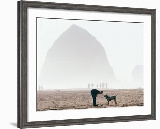 Playing Frisbee on Misty Morning, Cannon Beach, Oregon, USA-Janis Miglavs-Framed Photographic Print