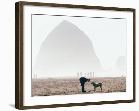 Playing Frisbee on Misty Morning, Cannon Beach, Oregon, USA-Janis Miglavs-Framed Photographic Print