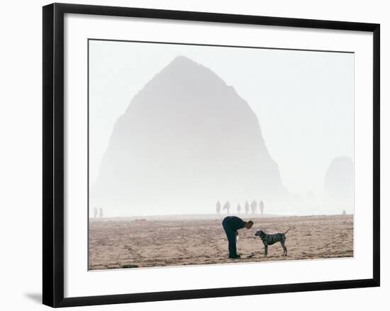 Playing Frisbee on Misty Morning, Cannon Beach, Oregon, USA-Janis Miglavs-Framed Photographic Print