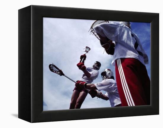 Playing Lacrosse-null-Framed Premier Image Canvas