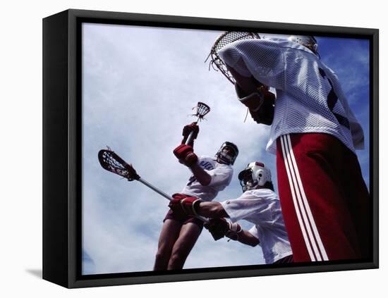 Playing Lacrosse-null-Framed Premier Image Canvas