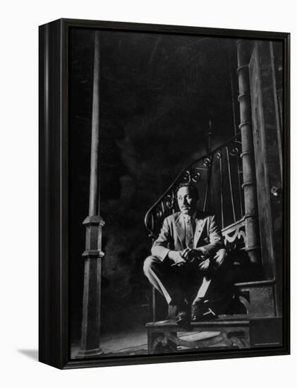 Playwright Tennessee Williams Sitting on Theater Set of His Play "Streetcar Named Desire"-Eliot Elisofon-Framed Premier Image Canvas