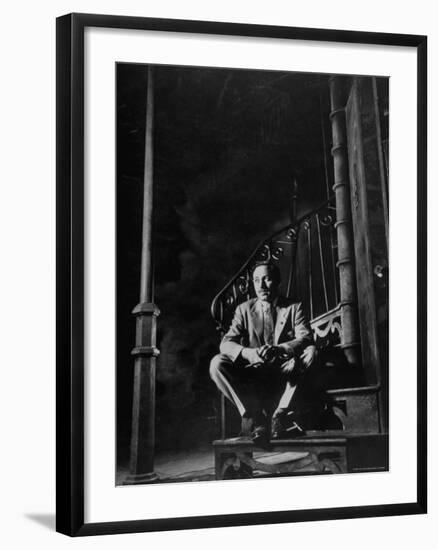 Playwright Tennessee Williams Sitting on Theater Set of His Play "Streetcar Named Desire"-Eliot Elisofon-Framed Premium Photographic Print