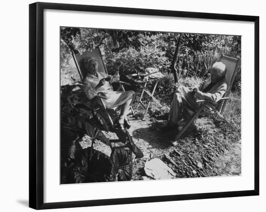 Poet Ezra Pound with Lover Olga Rudge, Chatting in Lounge Chairs Next to Breakfast Food in Garden-David Lees-Framed Premium Photographic Print