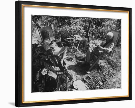 Poet Ezra Pound with Lover Olga Rudge, Chatting in Lounge Chairs Next to Breakfast Food in Garden-David Lees-Framed Premium Photographic Print