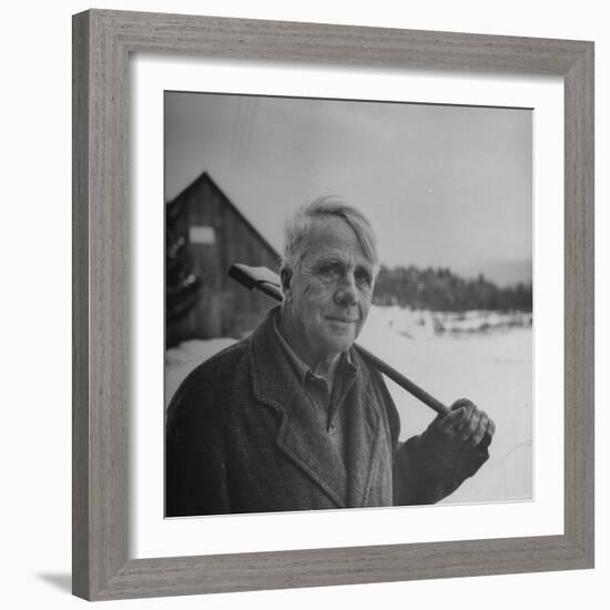 Poet Robert Frost in Affable Portrait, Axe Slung over Shoulder in Wintry Rural Setting-Eric Schaal-Framed Premium Photographic Print