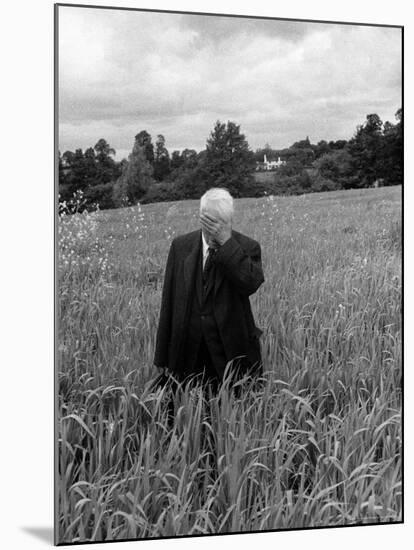 Poet Robert Frost Standing in Oxford Field with His Hand over His Face-Howard Sochurek-Mounted Premium Photographic Print