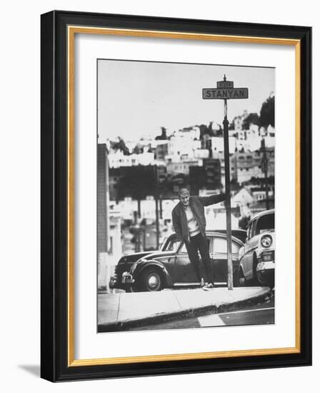 Poet Rod McKuen Swinging from Sign Which is Title of One His Songs, Stanyan Street-Ralph Crane-Framed Photographic Print