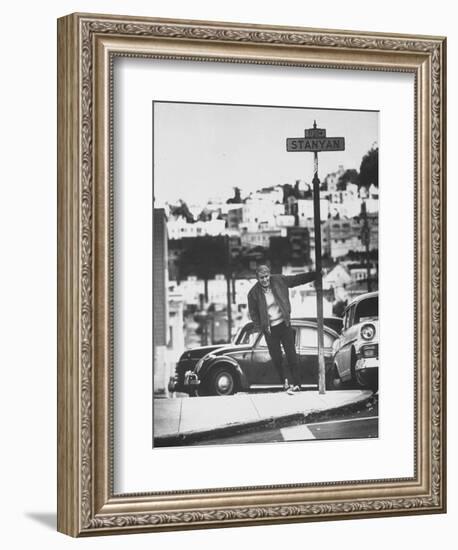 Poet Rod McKuen Swinging from Sign Which is Title of One His Songs, Stanyan Street-Ralph Crane-Framed Photographic Print