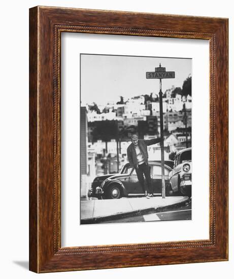 Poet Rod McKuen Swinging from Sign Which is Title of One His Songs, Stanyan Street-Ralph Crane-Framed Photographic Print