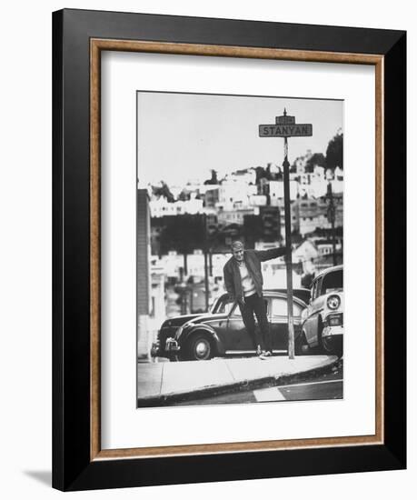 Poet Rod McKuen Swinging from Sign Which is Title of One His Songs, Stanyan Street-Ralph Crane-Framed Photographic Print