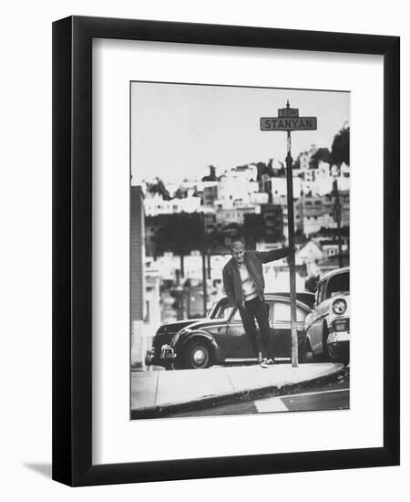 Poet Rod McKuen Swinging from Sign Which is Title of One His Songs, Stanyan Street-Ralph Crane-Framed Photographic Print