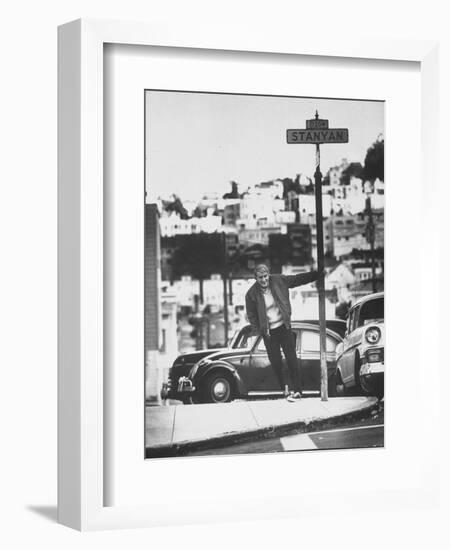 Poet Rod McKuen Swinging from Sign Which is Title of One His Songs, Stanyan Street-Ralph Crane-Framed Photographic Print