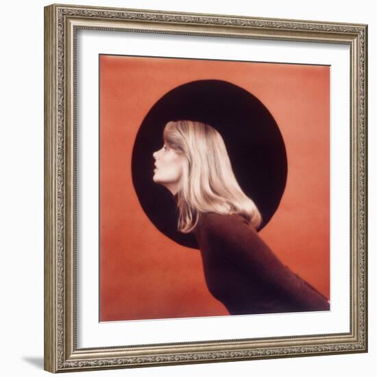 Polaroid, Profile of Woman in Brown Sweather Against Red Bkgd with Black Circle-Co Rentmeester-Framed Photographic Print