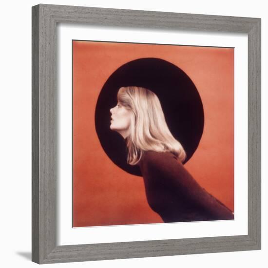 Polaroid, Profile of Woman in Brown Sweather Against Red Bkgd with Black Circle-Co Rentmeester-Framed Photographic Print