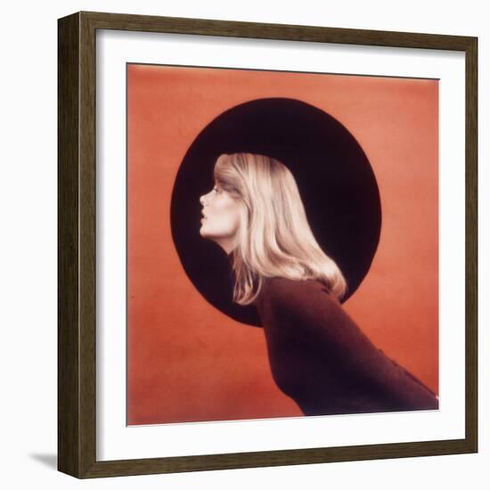 Polaroid, Profile of Woman in Brown Sweather Against Red Bkgd with Black Circle-Co Rentmeester-Framed Photographic Print