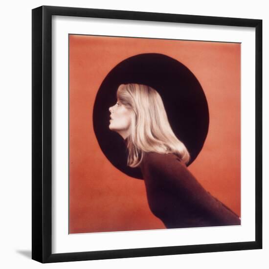 Polaroid, Profile of Woman in Brown Sweather Against Red Bkgd with Black Circle-Co Rentmeester-Framed Photographic Print