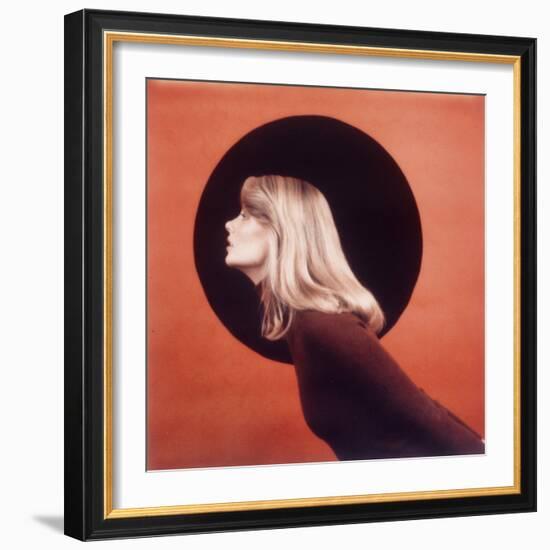 Polaroid, Profile of Woman in Brown Sweather Against Red Bkgd with Black Circle-Co Rentmeester-Framed Photographic Print