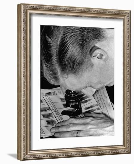 Police Investigator Examining a Set of Fingerprints-Carl Mydans-Framed Photographic Print