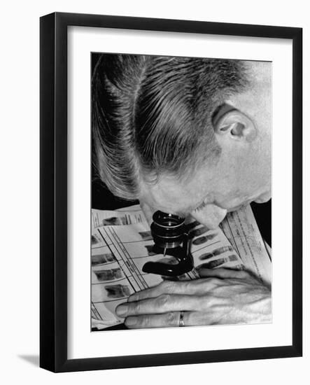 Police Investigator Examining a Set of Fingerprints-Carl Mydans-Framed Photographic Print